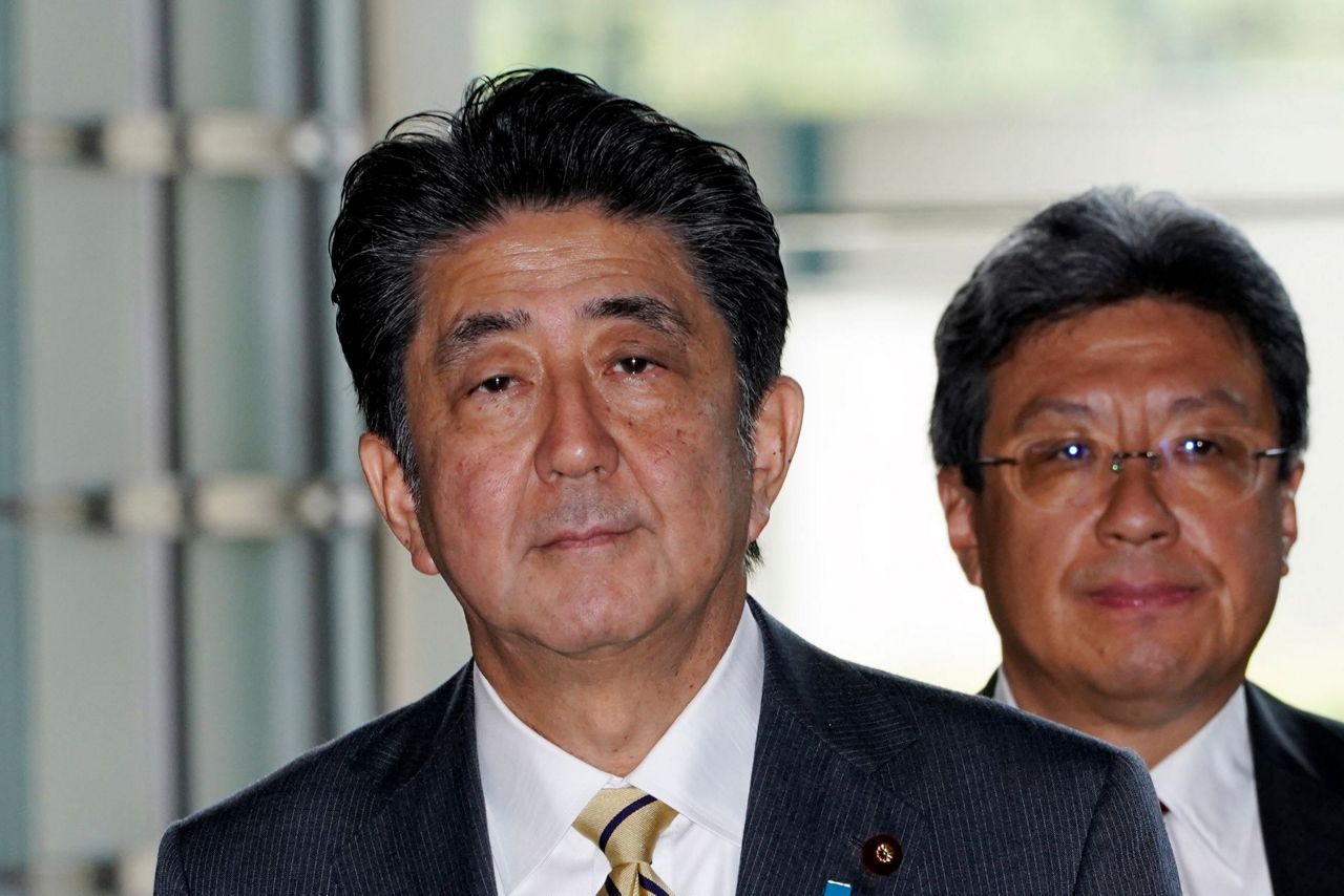 Japan taps ministers to freshen image, keep policies steady