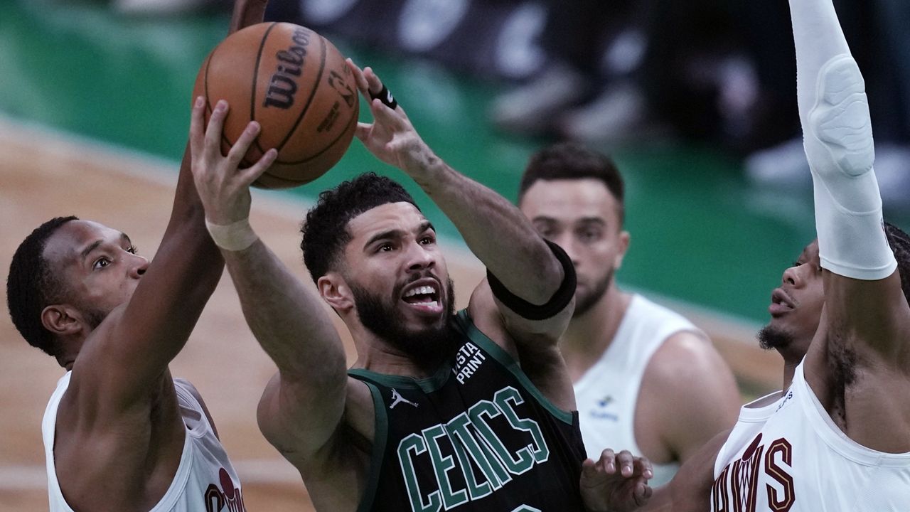 Boston Celtics forward Jayson Tatum (0) drives to the basket against the Cleveland Cavaliers during the first half of Game 5 of an NBA basketball second-round playoff series Wednesday, May 15, 2024, in Boston. (AP Photo/Charles Krupa)