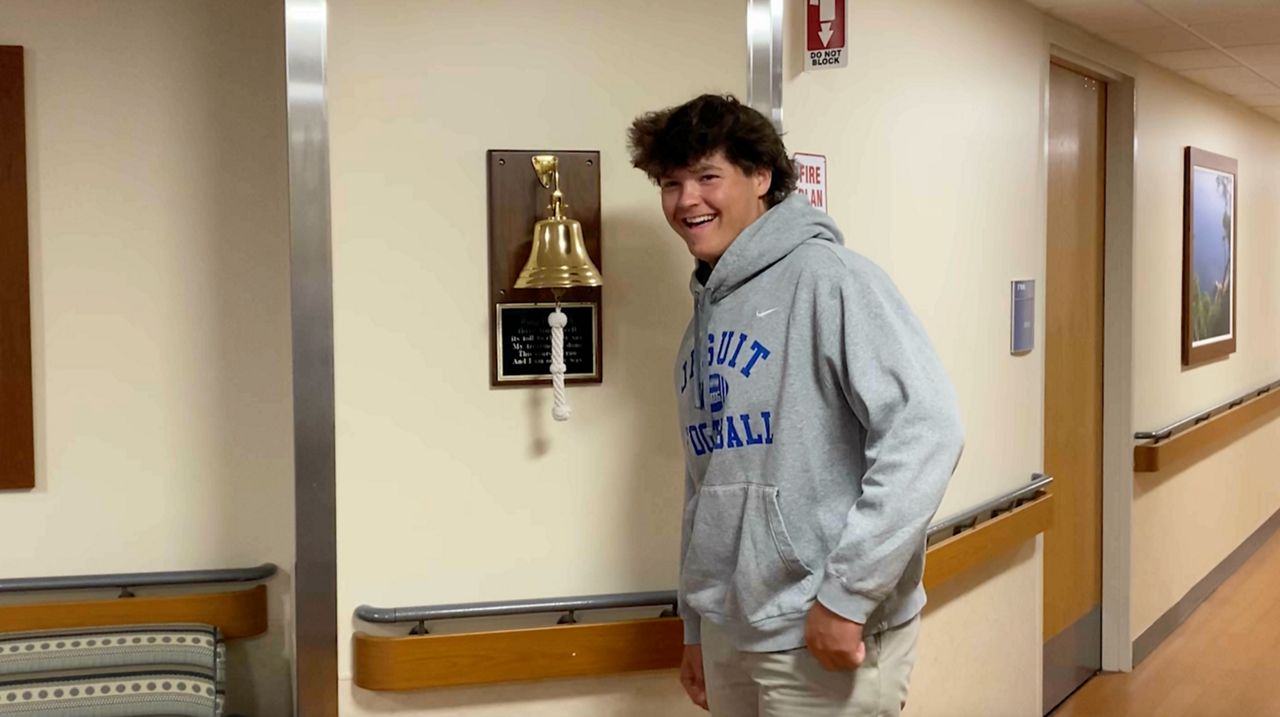 Defensive lineman Tucker Witte rang the cancer bell a day before Jesuit's spring football game.