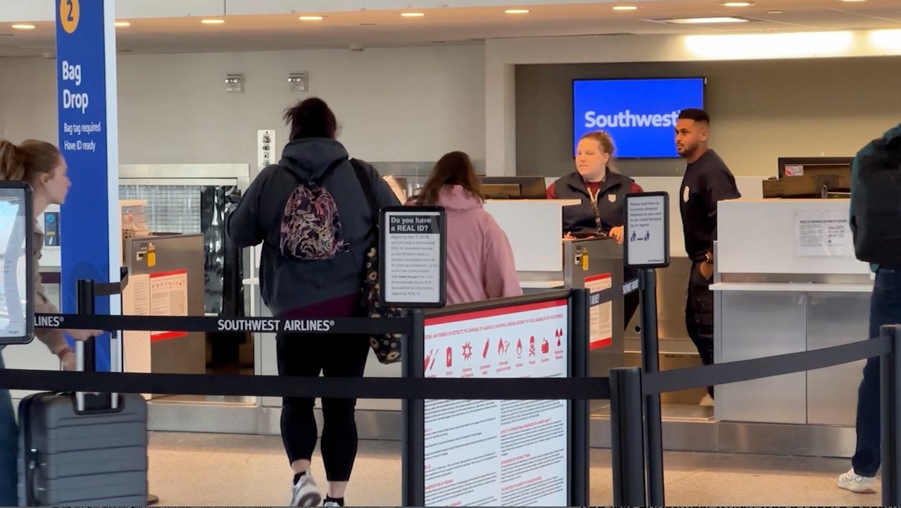 Passengers check in for their flights at Portland International Jetport. Officials expect thousands of passengers to pass through the jetport and Bangor International Airport during the holiday travel rush. (File photo)