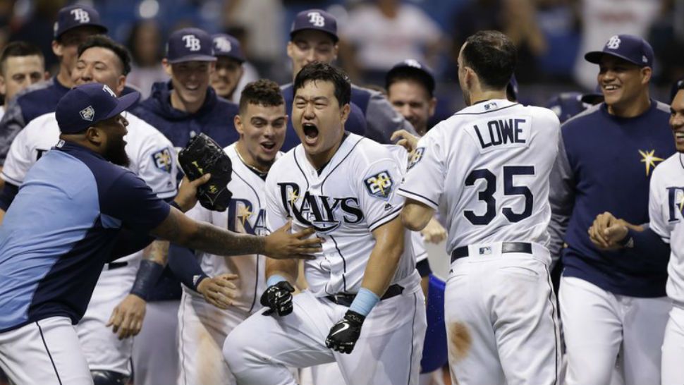Tampa Bay Rays’ Ji-Man Choi, of South Korea, center, celebrates his two-run walk-off home run off Cleveland Indians pitcher Brad Hand during the ninth inning of a baseball game Monday, Sept. 10, 2018, in St. Petersburg, Fla. (AP Photo/Chris O’Meara)