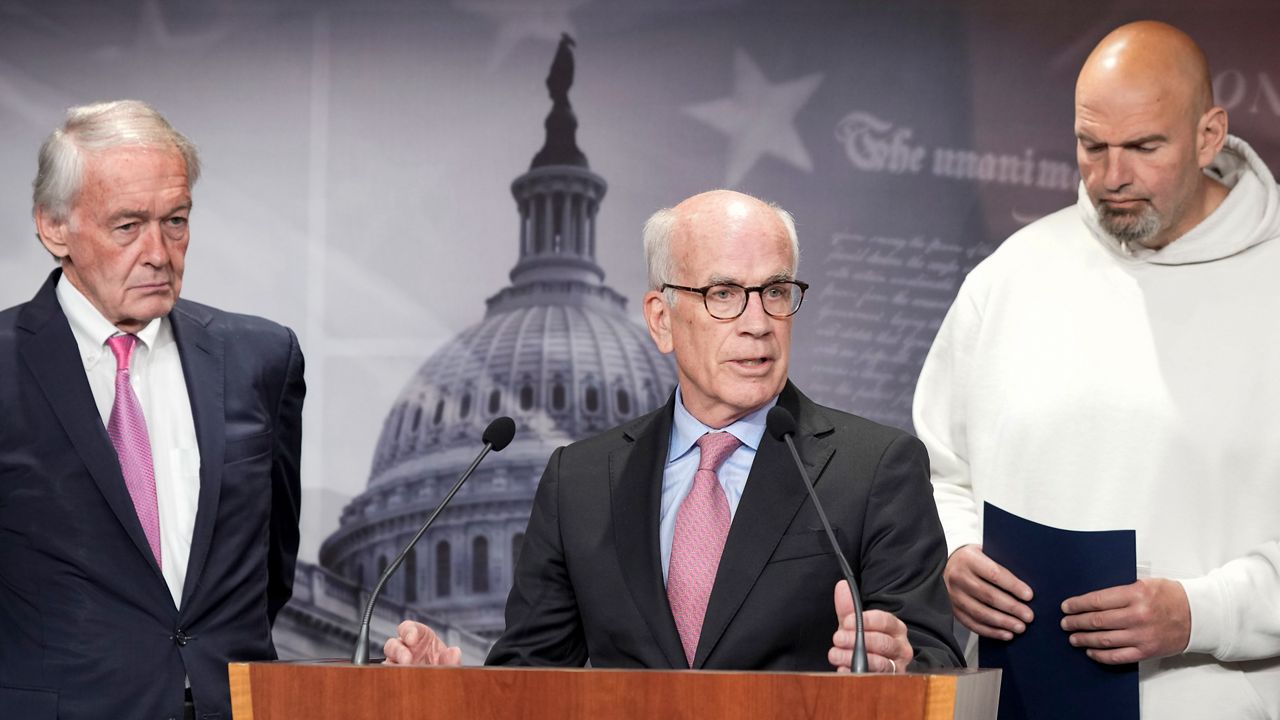 Sen. Peter Welch, D-Vt., center, speaks as Sen. Edward Markey, D-Mass., left and Sen. John Fetterman, D-Pa., right, listen during a news conference on the debt limit, Thursday, May 18, 2023, on Capitol Hill in Washington. Male senators are expected to wear a jacket and tie on the Senate floor, but Fetterman has a workaround, he votes from the doorway of the Democratic cloakroom or the side entrance, making sure his “yay” or “nay” is recorded before ducking back out. (AP Photo/Mariam Zuhaib, File)