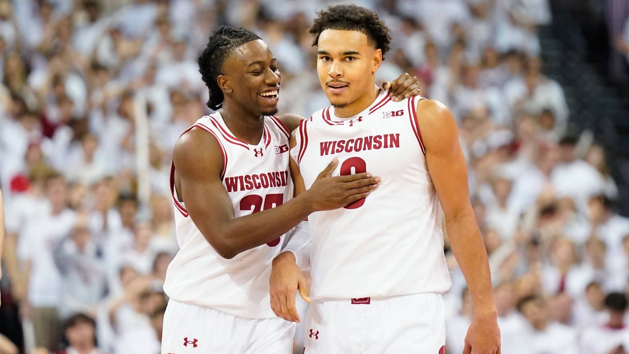 Wisconsin guard John Blackwell (25) celebrates a basket with Wisconsin guard John Tonje (9) during the second half of an NCAA college basketball game against Arizona Friday, Nov. 15, 2024, at the Kohl Center in Madison, Wis. 