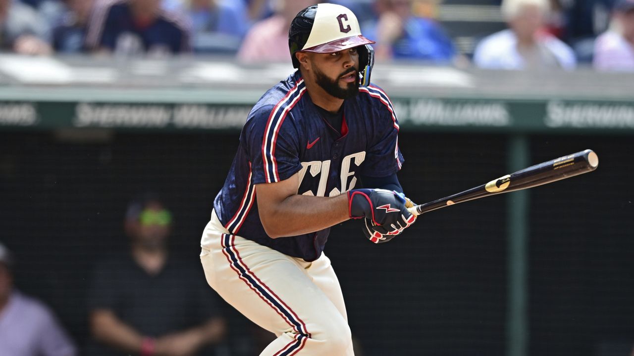 Cleveland Guardians' Johnathan Rodriguez runs after hitting an RBI single during the seventh inning of a baseball game against the New York Mets, Wednesday, May 22, 2024, in Cleveland. David Fry scored on the play. (AP Photo/David Dermer)