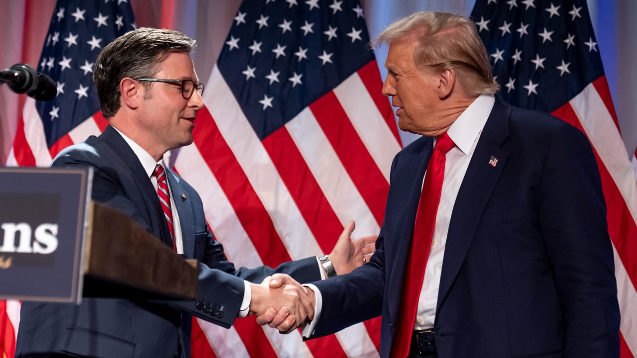 President-elect Donald Trump shakes hands with House Speaker Mike Johnson of La., as he arrives to speak at a meeting with the House GOP conference, Wednesday, Nov. 13, 2024, in Washington. (AP Photo/Alex Brandon)