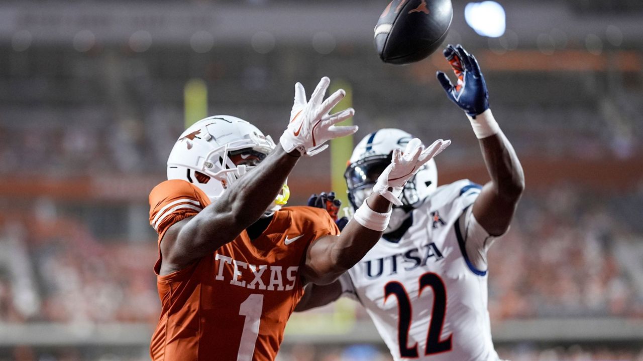 Texas wide receiver Johntay Cook II (1) makes a touchdown catch in front of UTSA safety Elijah Newell (22) during the second half of an NCAA college football game in Austin, Texas, Sept. 14, 2024. (AP Photo/Eric Gay, File)