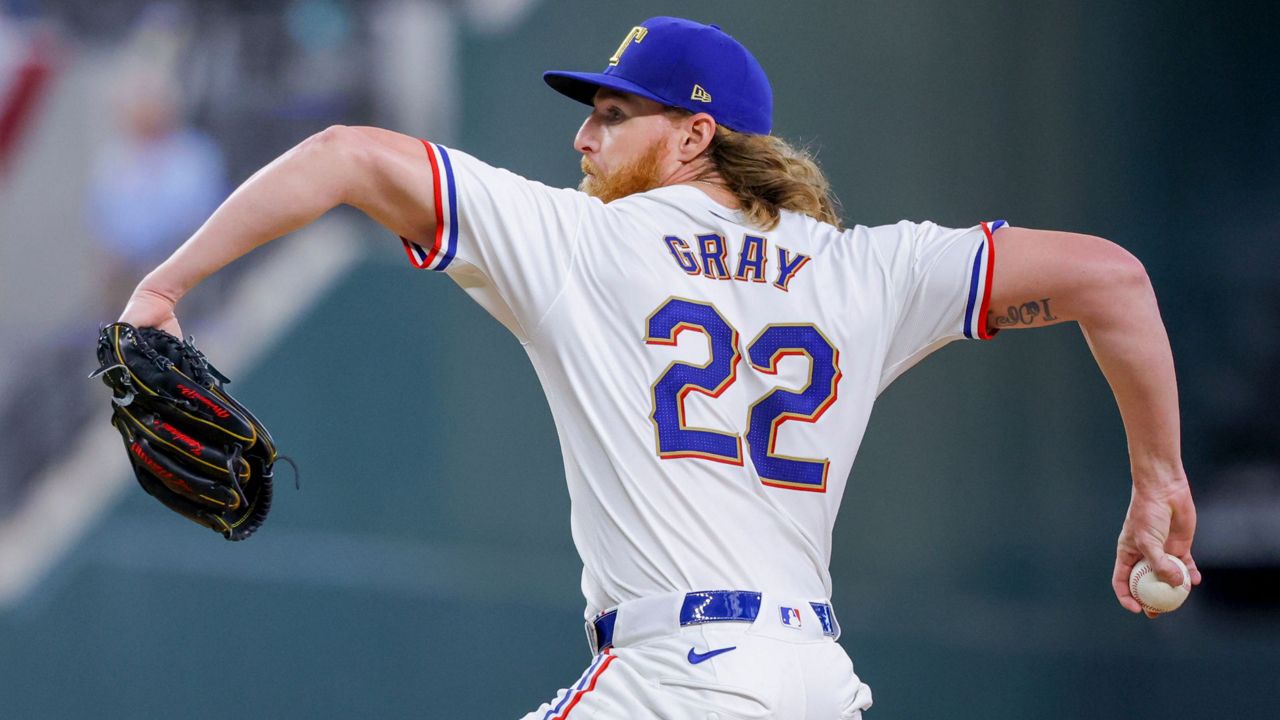 Texas Rangers starting pitcher Jon Gray delivers a pitch during the third inning of a baseball game against the Chicago Cubs, Sunday, March 31, 2024, in Arlington, Texas. (AP Photo/Gareth Patterson)