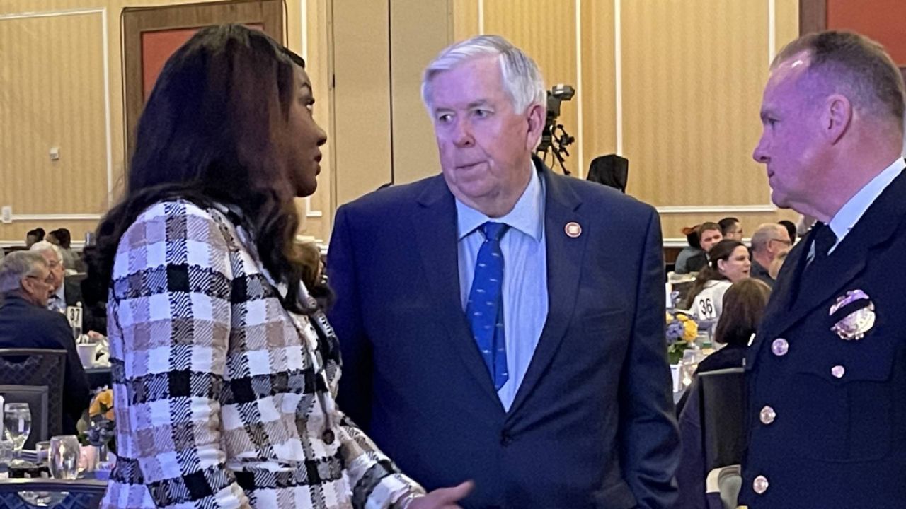 St. Louis Mayor Tishaura Jones, Missouri Gov. Mike Parson and St. Louis Metropolitan Police Department Chief Robert Tracy in conversation prior to the SLMPD Memorial Breakfast honoring fallen officers Wednesday in St. Louis, Mo. (Spectrum News/Gregg Palermo)