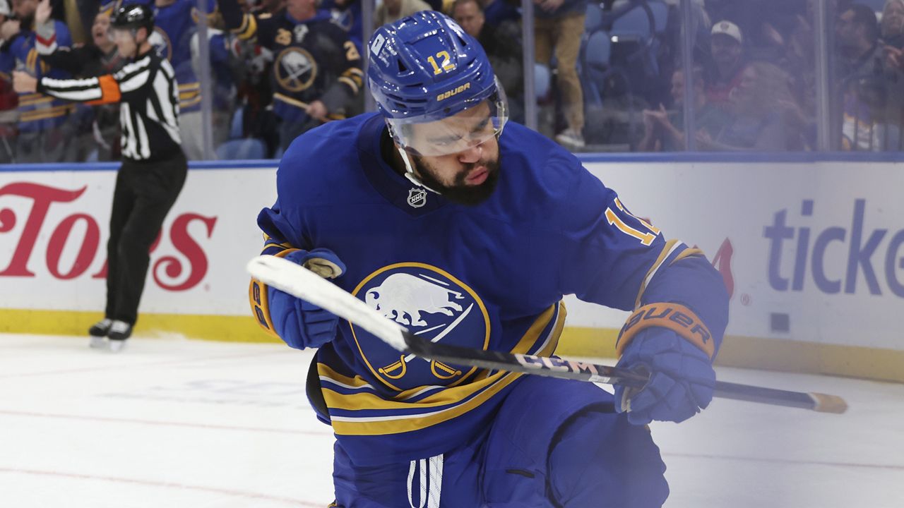 Buffalo Sabres left wing Jordan Greenway (12) celebrates his goal during the first period of an NHL hockey game against the Florida Panthers, Saturday, Oct. 12, 2024, in Buffalo, N.Y. (AP Photo/Jeffrey T. Barnes)