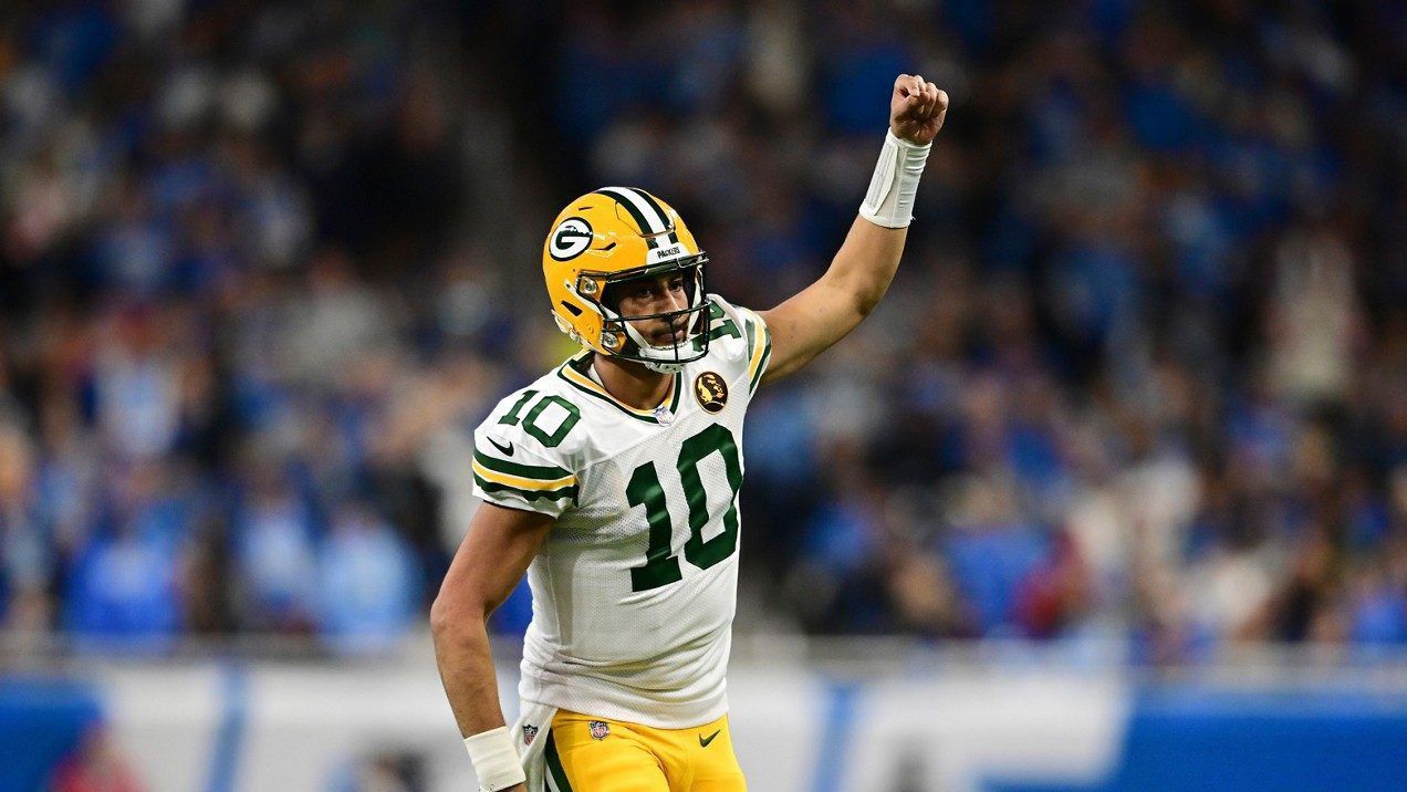 Green Bay Packers quarterback Jordan Love runs up field after throwing a touchdown to wide receiver Christian Watson during the second half of an NFL football game against the Detroit Lions, Thursday, Nov. 23, 2023, in Detroit. 
