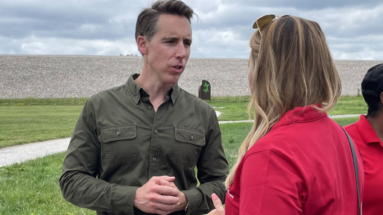 U.S. Sen. Josh Hawley, R-Mo. talks to Missouri State Rep. Holly Jones, R-Eureka, following a news conference at the Weldon Spring Site Interpretive Center in St. Charles County on July 13, 2023. (Spectrum News/Gregg Palermo)