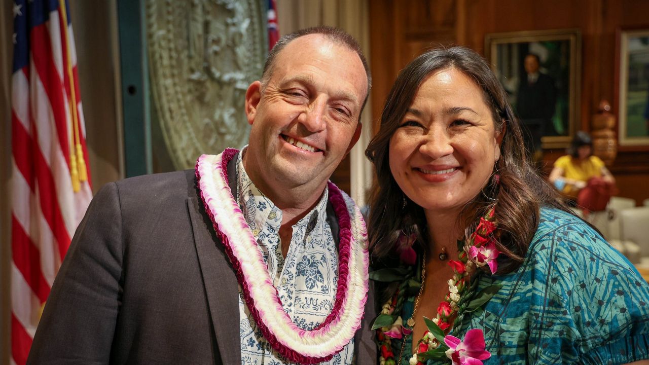 Office of Wellness and Resilience director Tia Hartsock (right) joined Gov. Josh Green at Tuesday's signing of Executive Order 24-01. (Office of Gov. Josh Green)