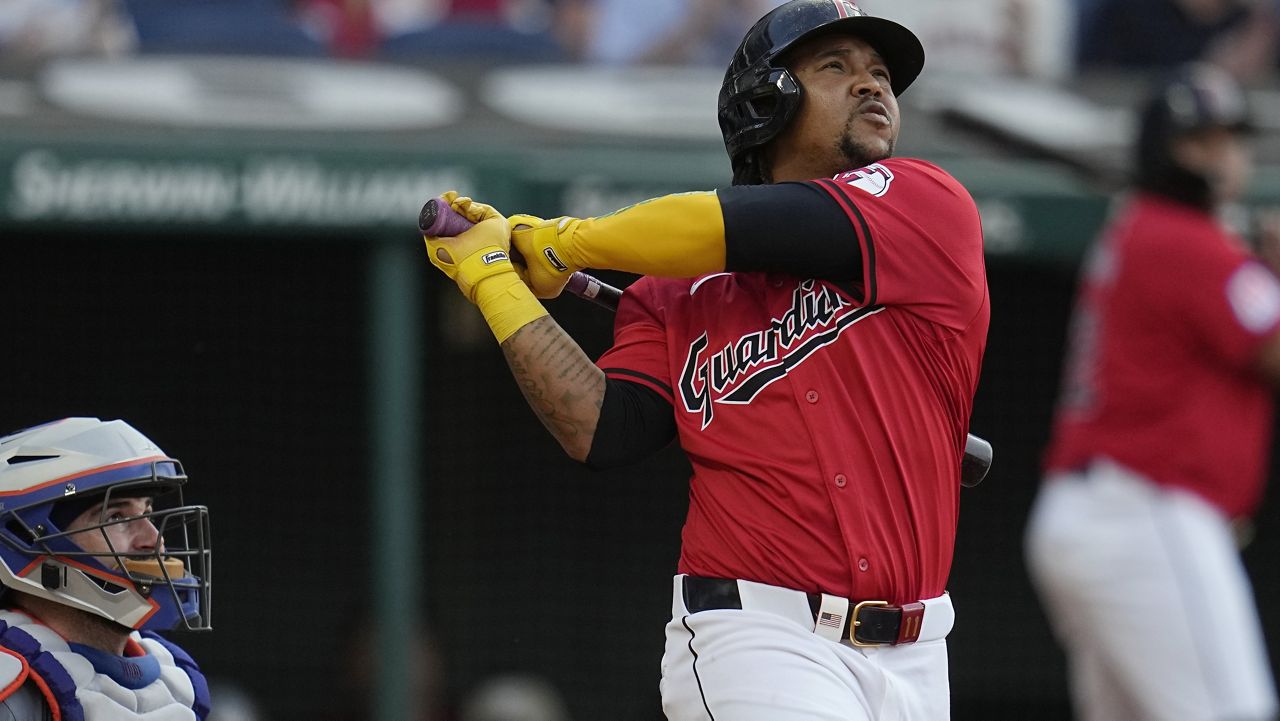 Cleveland Guardians' José Ramírez gestures as he runs to home plate on a home run against the New York Mets during the fifth inning of a baseball game Tuesday, May 21, 2024, in Cleveland. (AP Photo/Sue Ogrocki)