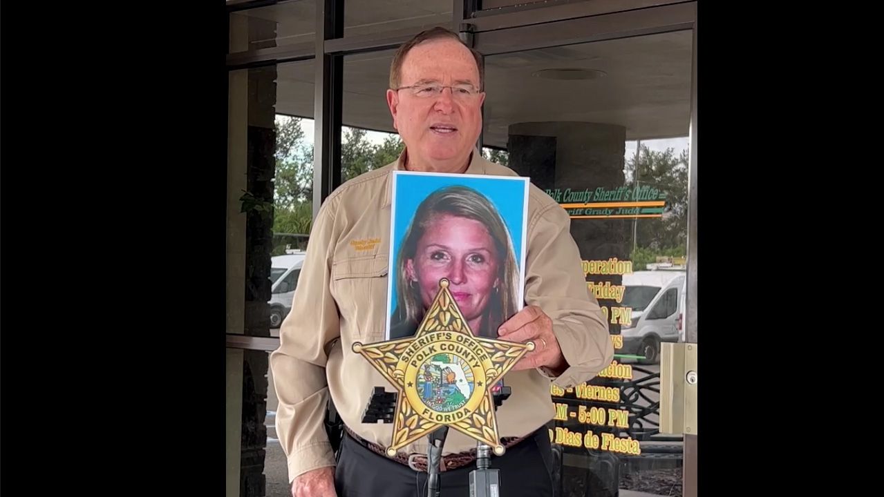 Polk County, Florida, Sheriff Grady Judd displays a photo of Brandy Hutchins in a press conference with reporters in Florida on Sunday. Judd said Hutchins killed her 10-year-old son, Aiden, along with herself and her 19-year-old daughter. Judd said she committed the murders after losing a custody battle over her son with Nick Hutchins, the boy's father, who lives in Maine. (Polk County Sheriff's Department)