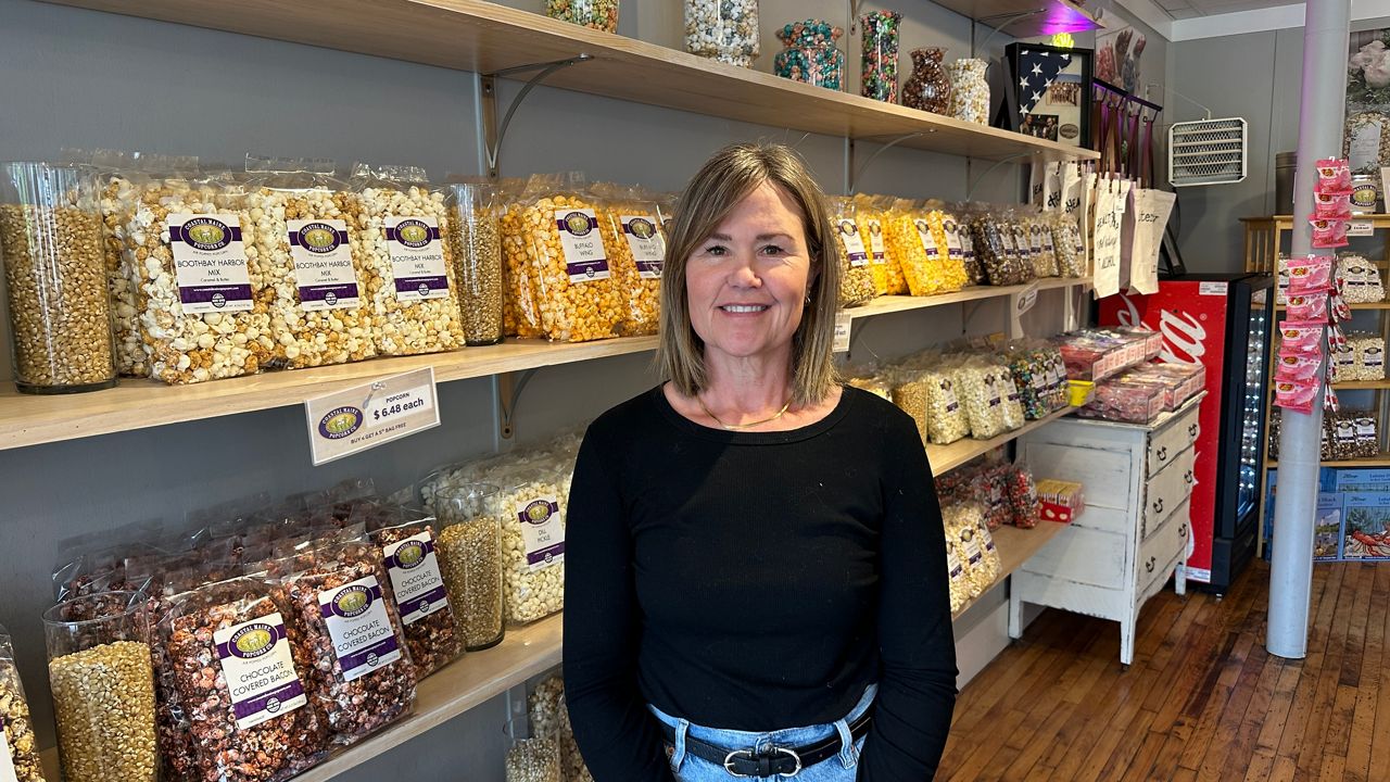 Julie Roberts, owner of Coastal Maine Popcorn in Boothbay Harbor, says she’s hopeful for a busy 2026 season. (Spectrum News/Susan Cover)