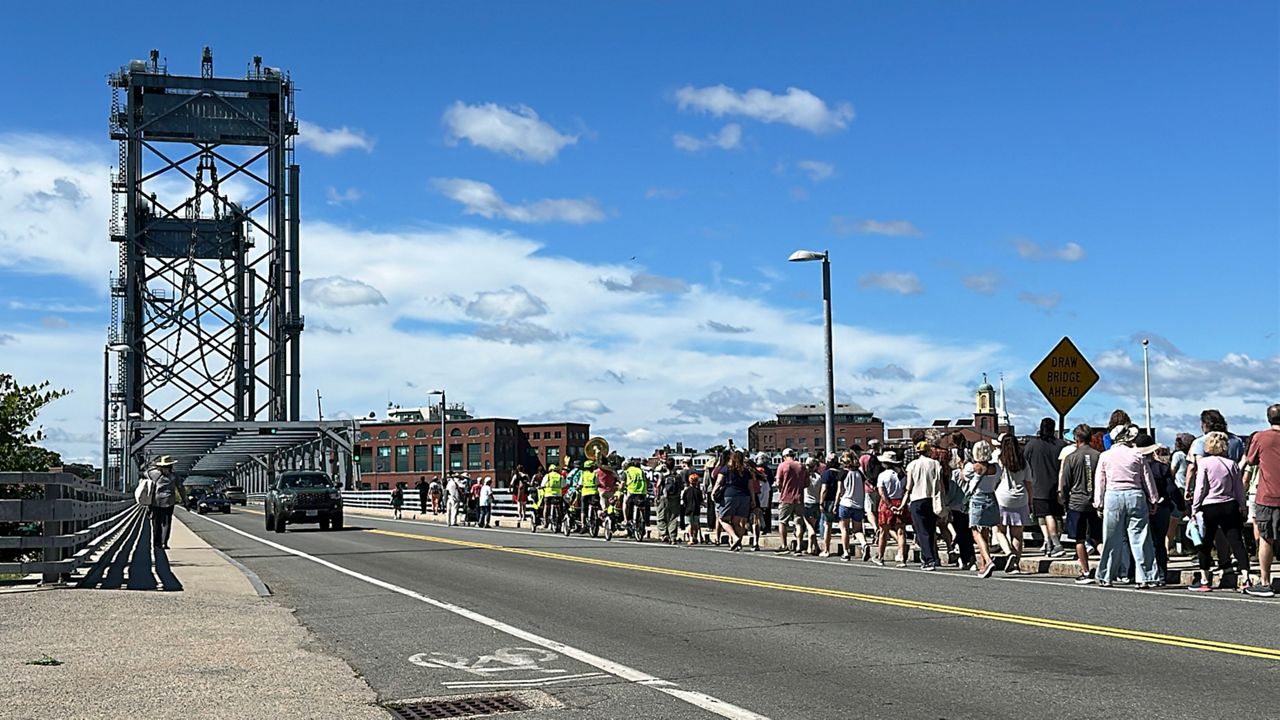 Participants begin crossing the Memorial Bridge from Kittery into Portsmouth Friday as part of the annual Juneteenth Freedom Walk. (Spectrum News/Sean Murphy)