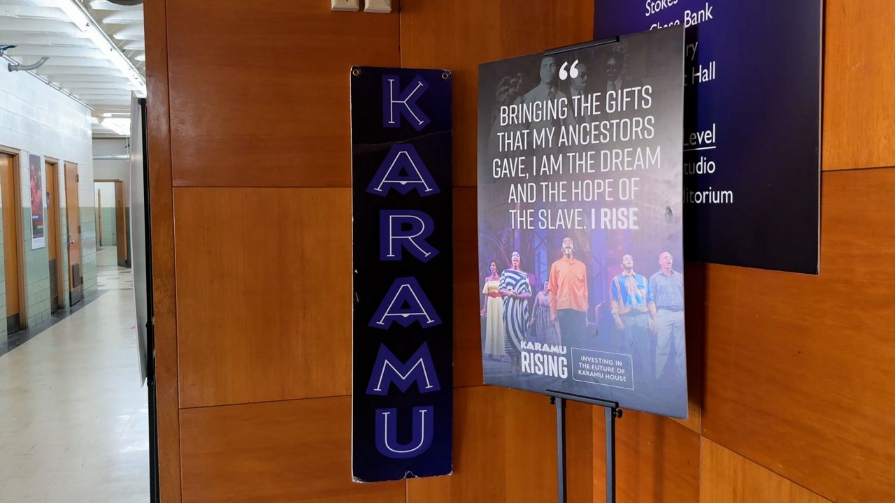 A Karamu House sign inside the Karamu House building.
