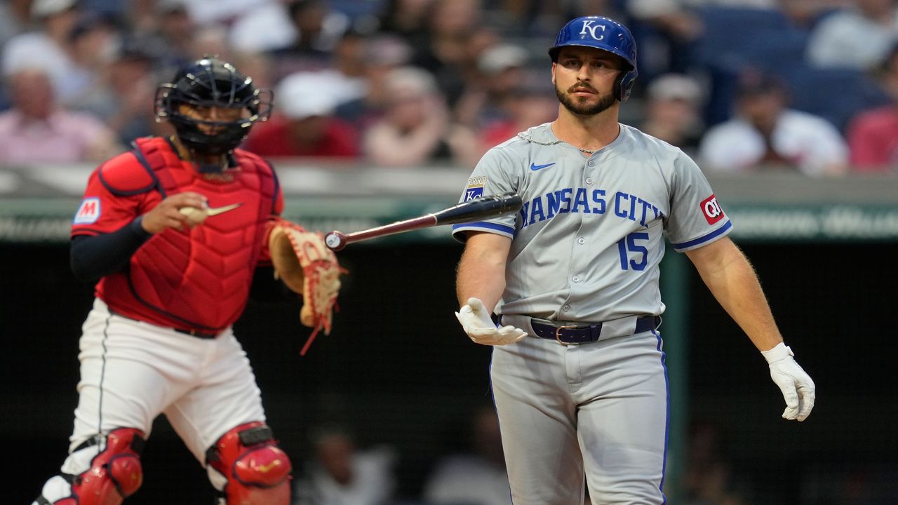 Kansas City Royals' Paul DeJong (15) flips his bat in front of Cleveland Guardians fourth inning of a baseball game Tuesday, Aug. 27, 2024, in Cleveland. (AP Photo/Sue Ogrocki)