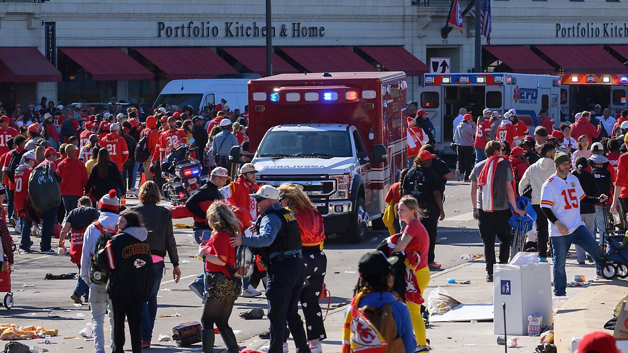 A woman is taken to an ambulance after an incident following the Kansa City Chiefs NFL football Super Bowl celebration in Kansas City, Mo., Wednesday, Feb. 14, 2024. The Chiefs defeated the San Francisco 49ers Sunday in the Super Bowl 58. (AP Photo/Reed Hoffmann)