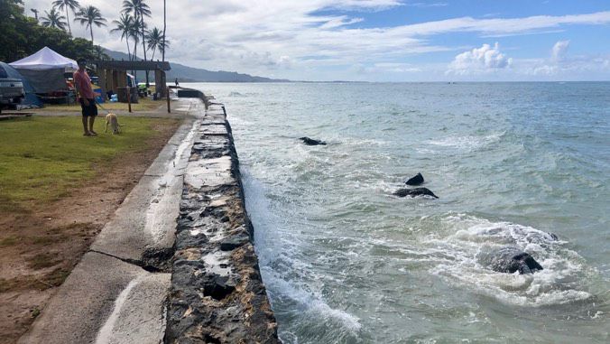 One of the PROTECT project grants will be used to build a rock revetment to prevent coastal erosion on Kamehameha Highway in Kaaawa. (University of Hawaii Economic Research Organization)