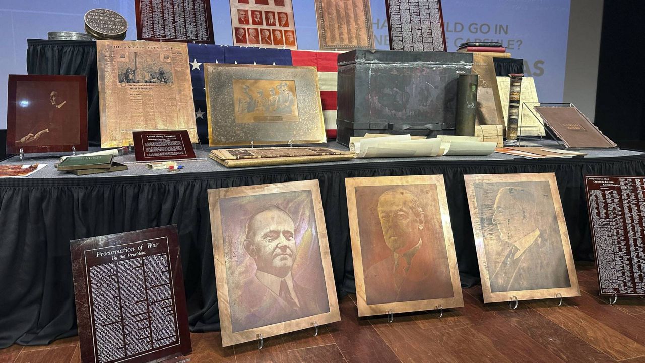 Artifacts from a 100-year-old time capsule, including metal etchings of U.S. presidents, local newspaper printing plates and a container of seeds, were revealed to the public by the National World War I Museum and Memorial, Wednesday, Oct. 16. 2024. in Kansas City, Mo. (AP Photo/Nick Ingram)