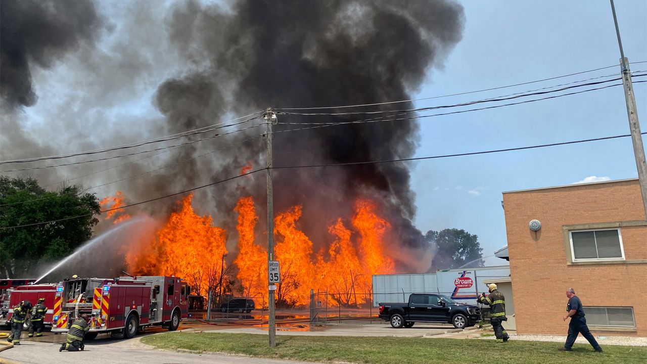 This photo provided by the Kansas City Fire Department shows a wood-pallet warehouse burning in the Northeast Industrial District in Kansas City, Mo., Thursday, June 15, 2023. (Jason Spreitzer/Kansas City Fire Department via AP)