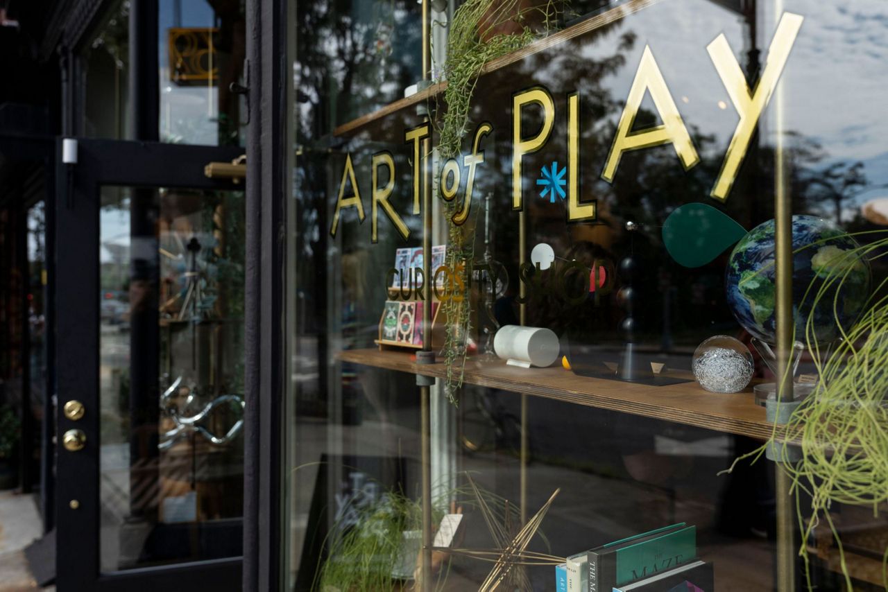 A close view of the Art of Play storefront in Brooklyn, New York, during coverage of the Kelly Clarkson dispute