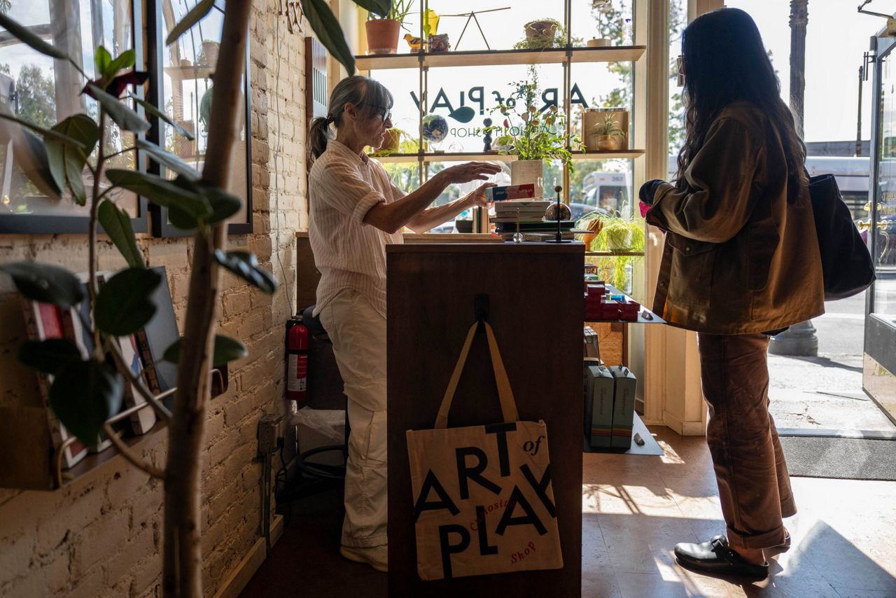A customer shopping inside Art of Play in Brooklyn