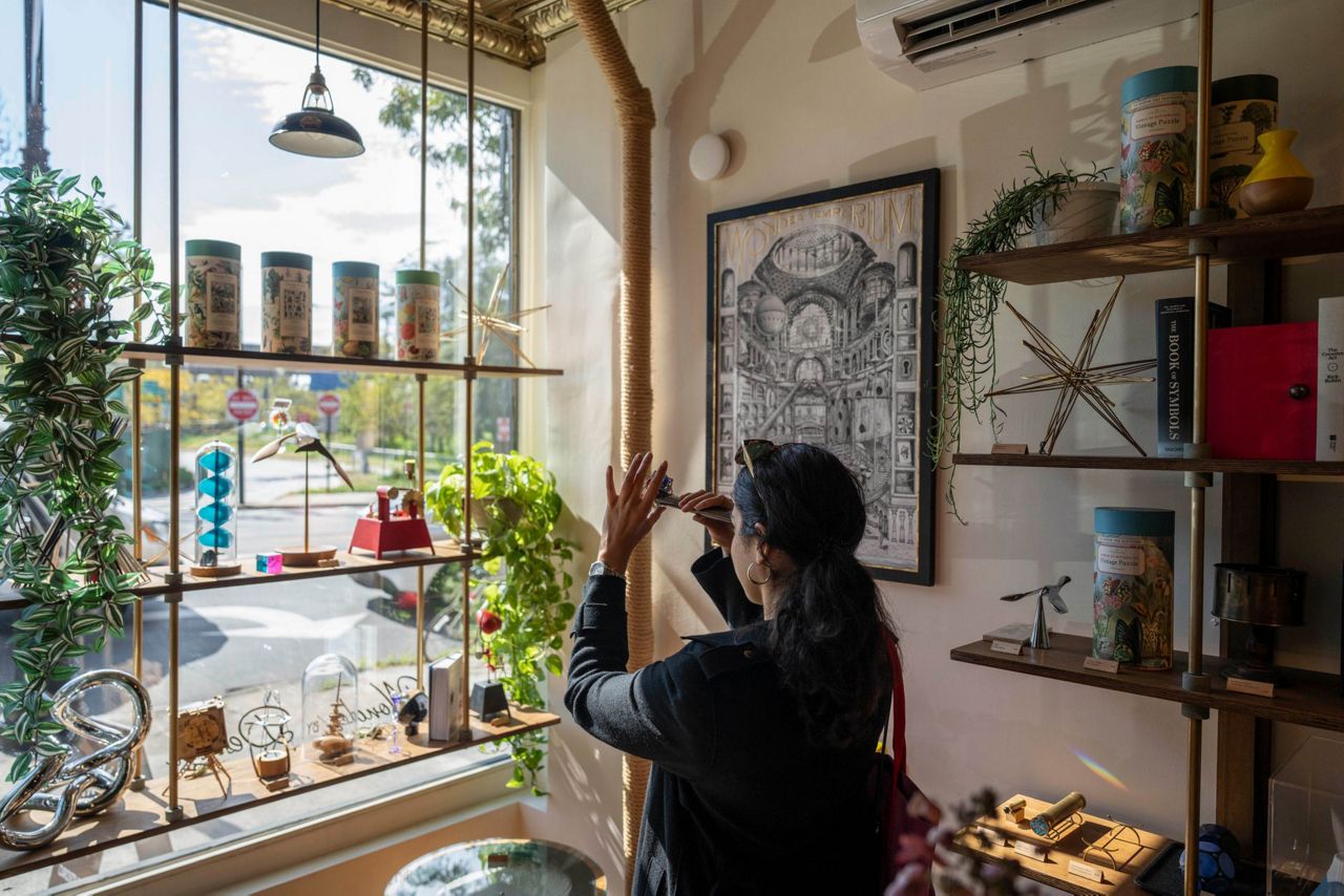 A customer browsing merchandise inside Art of Play in Brooklyn during the store's dispute with Kelly Clarkson