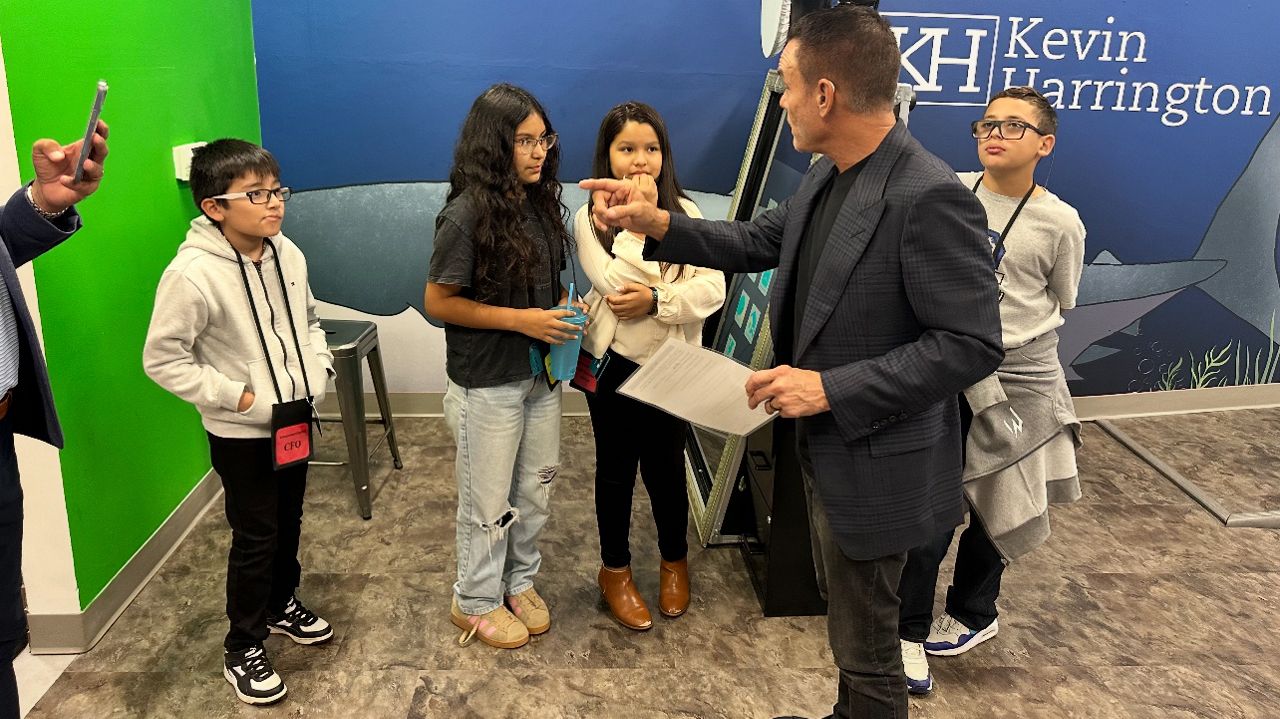 Kevin Harrington guides young entrepreneurs at the Entrepreneurship Hub at Junior Achievement of Tampa Bay’s BizTown. (Courtesy of Junior Achievement of Tampa Bay)