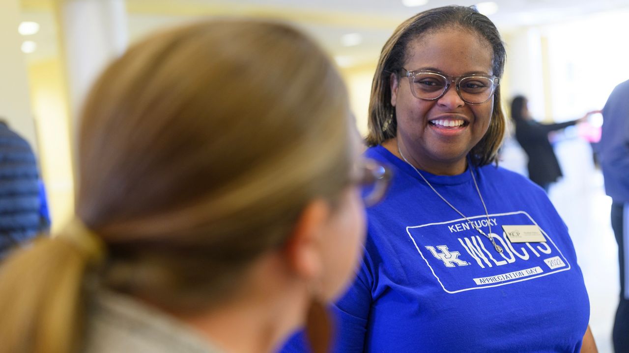 Khadijah Wallace, a new community health worker at UK Markey Cancer Center smilies as she greets community members. (UK Markey Cancer Center)