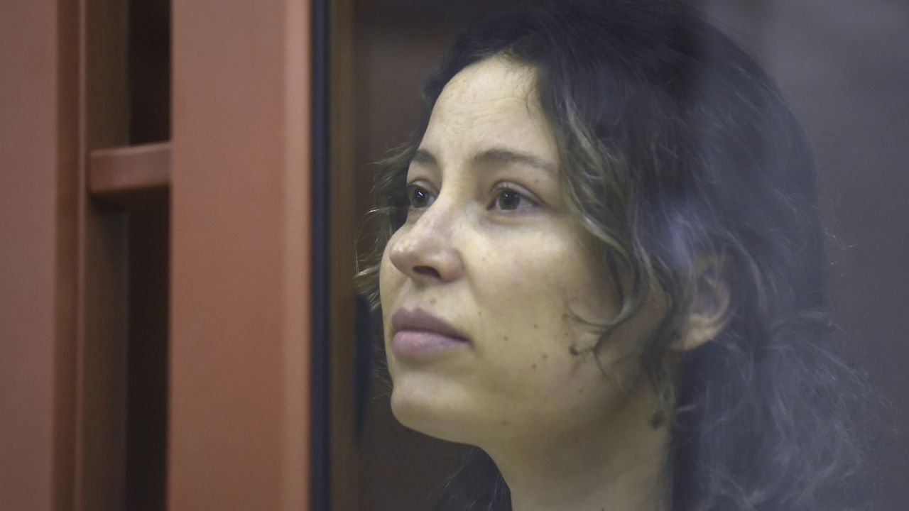 Ksenia Karelina, also known as Khavana sits in a glass cage in a court room in Yekaterinburg, Russia, Thursday, Aug. 15, 2024. (AP Photo)