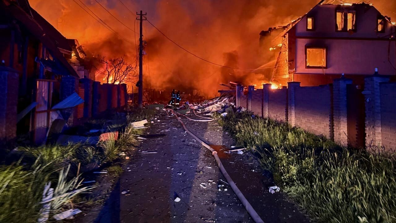 In this photo provided by the Ukrainian Emergency Service, firefighters try to put out a fire following a Russian attack in Kyiv region, Ukraine, Sunday, May 25, 2025. (Ukrainian Emergency Service via AP)