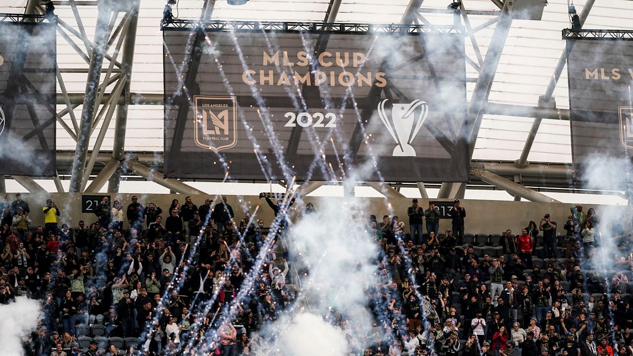 A banner celebrating Los Angeles FC's 2022 MLS Championship title is unveiled before the team's MLS soccer match against the Portland Timbers, Saturday, March 4, 2023, in Los Angeles. (AP Photo/Jae C. Hong)