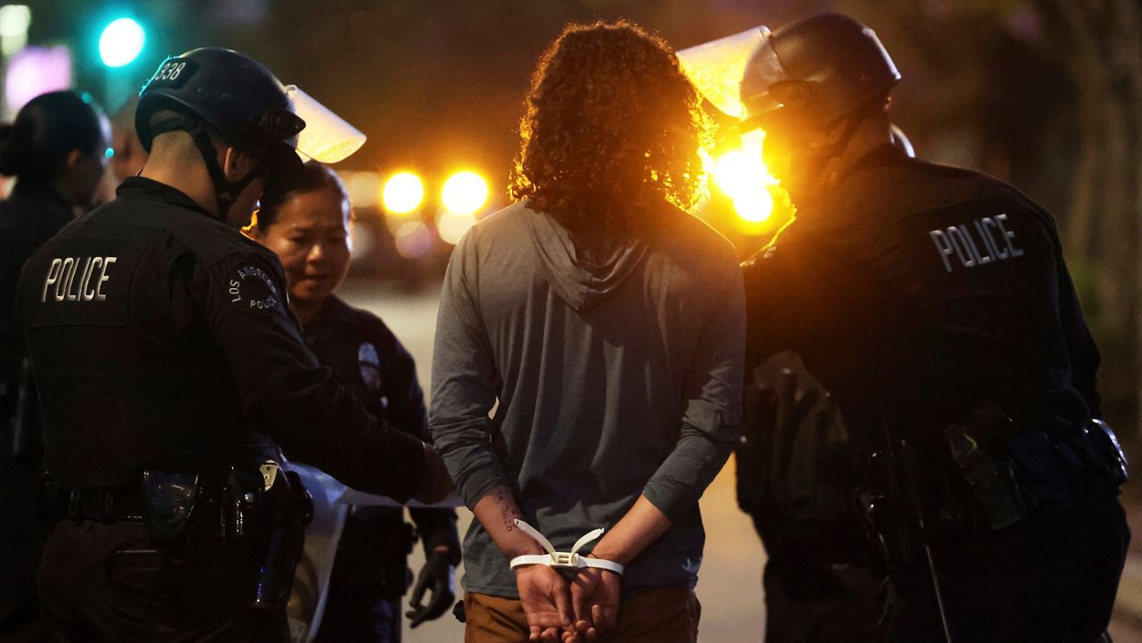 Los Angeles police arrest a protester on Wednesday, June 11, 2025, in Los Angeles. (AP Photo/Ethan Swope)