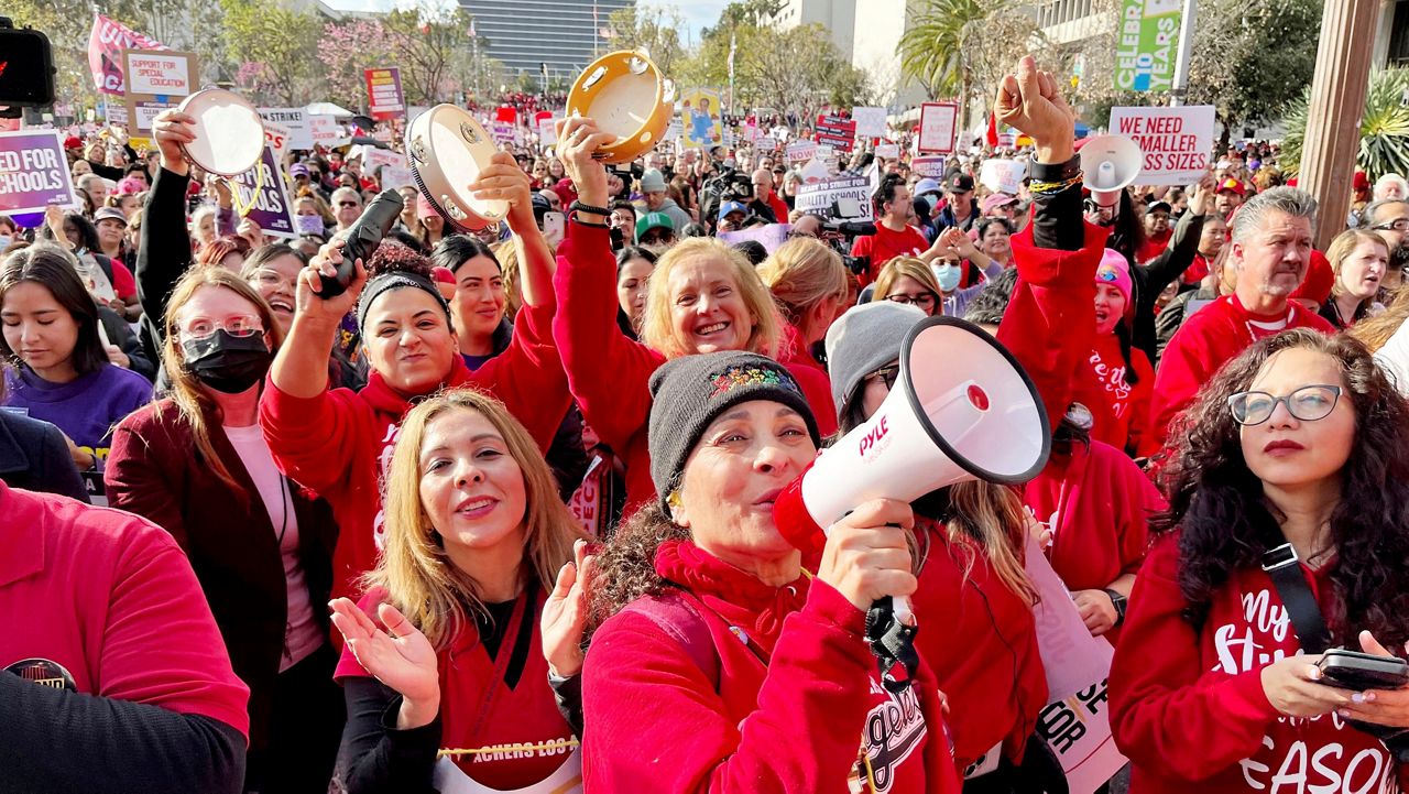 Sylvia Garcia, from Bassett Street Elementary, talks as she and other teachers attend a Los Angeles Unified School District and Service Employees International Union 99 (SEIU) rally in Grand Park in downtown Los Angeles, Wednesday, March 15, 2023. (Francine Orr/Los Angeles Times via AP)