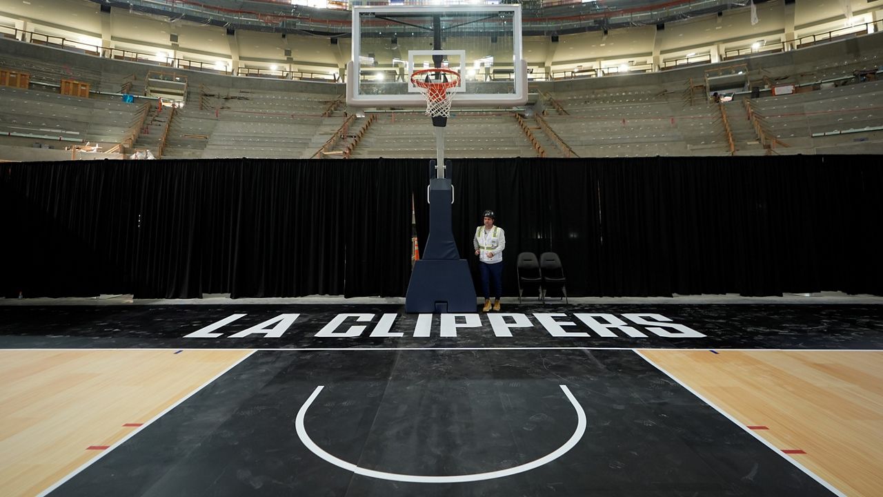 A court stands at the under-construction Intuit Dome on Tuesday, Jan. 16, 2024, in Inglewood, Calif. The NBA has been awarded the 2026 All-Star Game to the Los Angeles Clippers' new arena, which is scheduled to open in time for the 2024-25 season. (AP Photo/Damian Dovarganes)