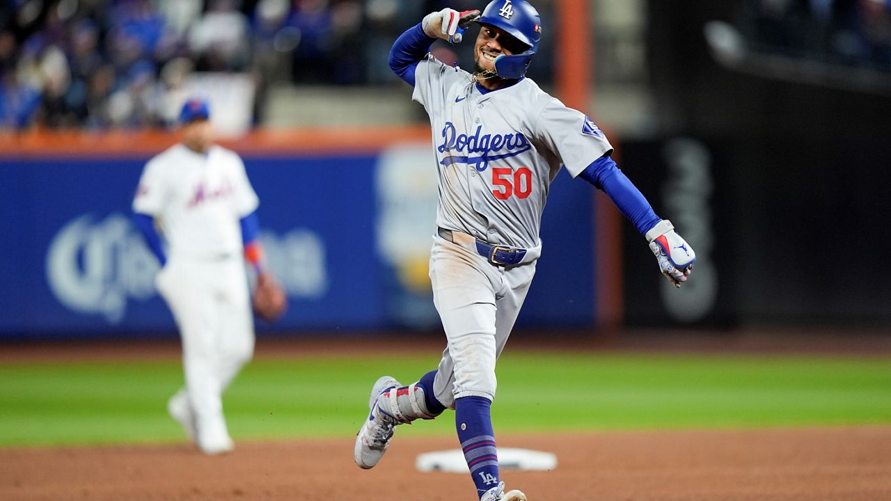 Los Angeles Dodgers' Mookie Betts celebrates after a two-run home run against the New York Mets during the sixth inning in Game 4 of a baseball NL Championship Series, Thursday, Oct. 17, 2024, in New York. (AP Photo/Frank Franklin II)