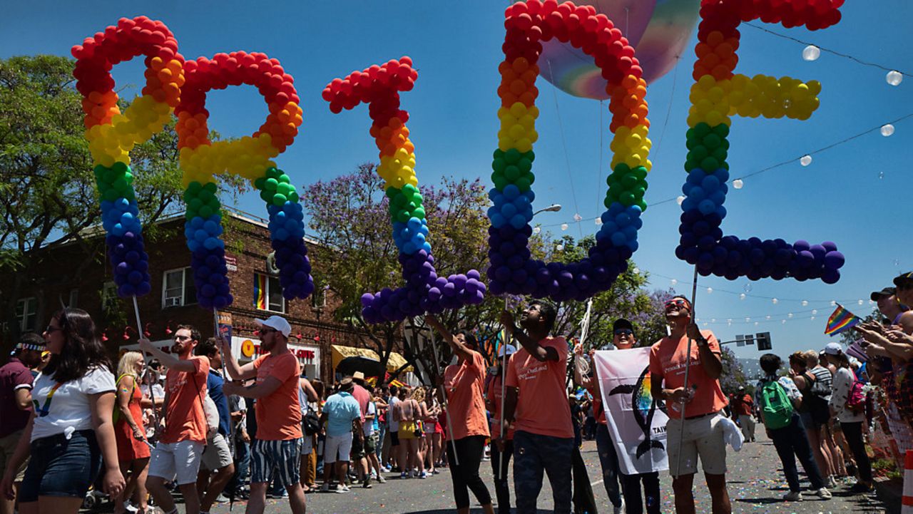 Participants take part in the annual LA Pride Parade in West Hollywood, Calif., Sunday, June 9, 2019. (AP Photo/Richard Vogel, File)