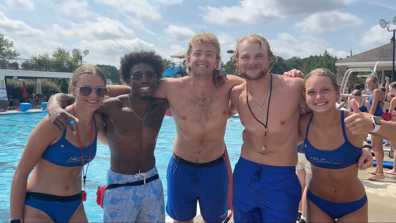 A team of lifeguard gets ready to compete in the lifeguard Olympics. (Spectrum News 1/Jenna Rae Gaertner)