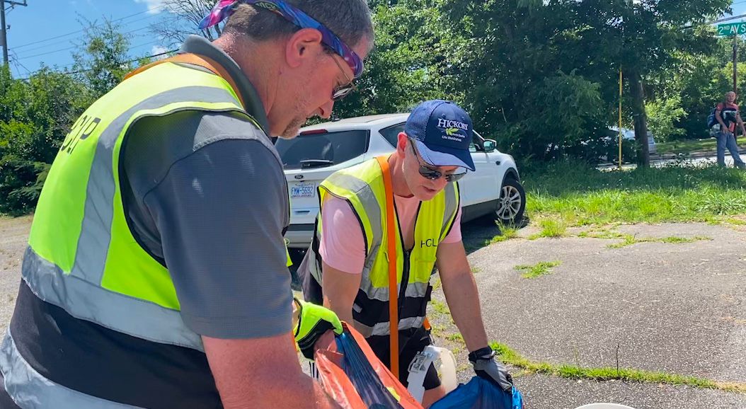Todd Byrd and Bruce Hooker clean up litter. 
