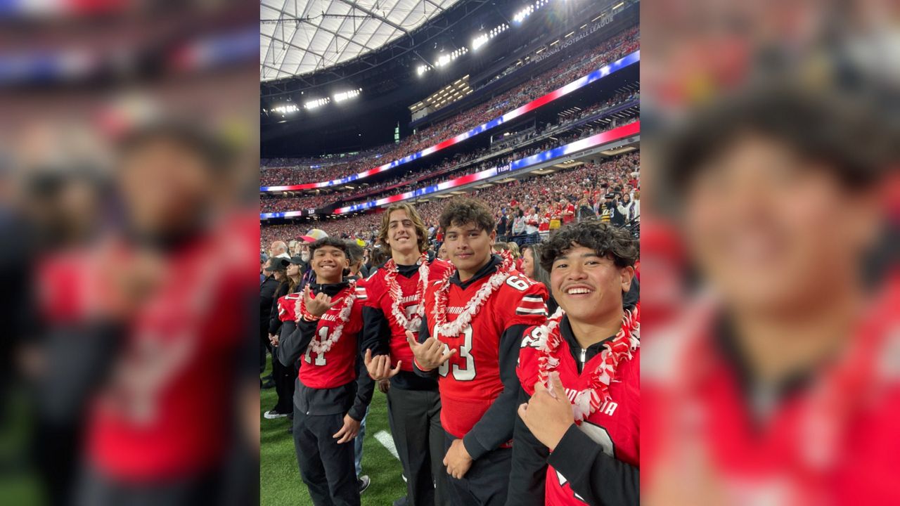 In this Feb. 11, 2024, image provided by Jonathan Conrad, athletic director at Lahainaluna High School, members of the Lahainaluna High School football team flash the "shaka" hand gesture as they pose for a photo while attending the NFL Super Bowl 58 football game in Las Vegas. (Jonathan Conrad via AP)