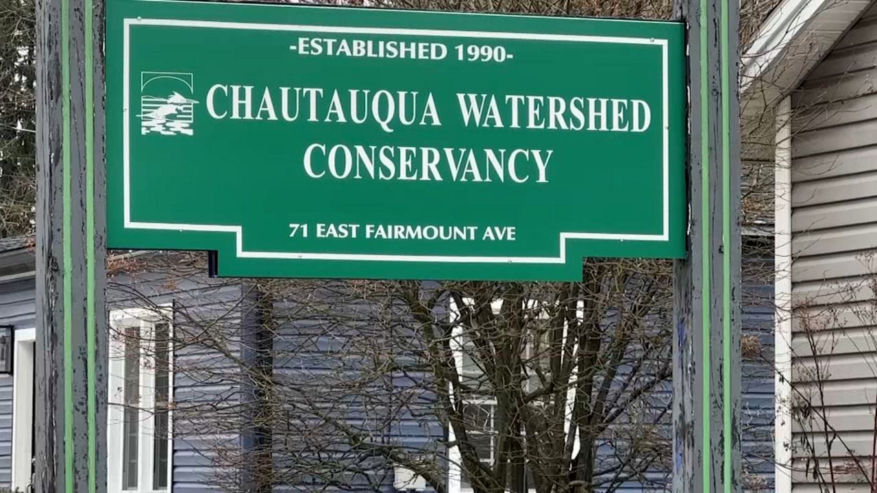 Chautauqua Watershed Conservancy sign hanging in front of buildings