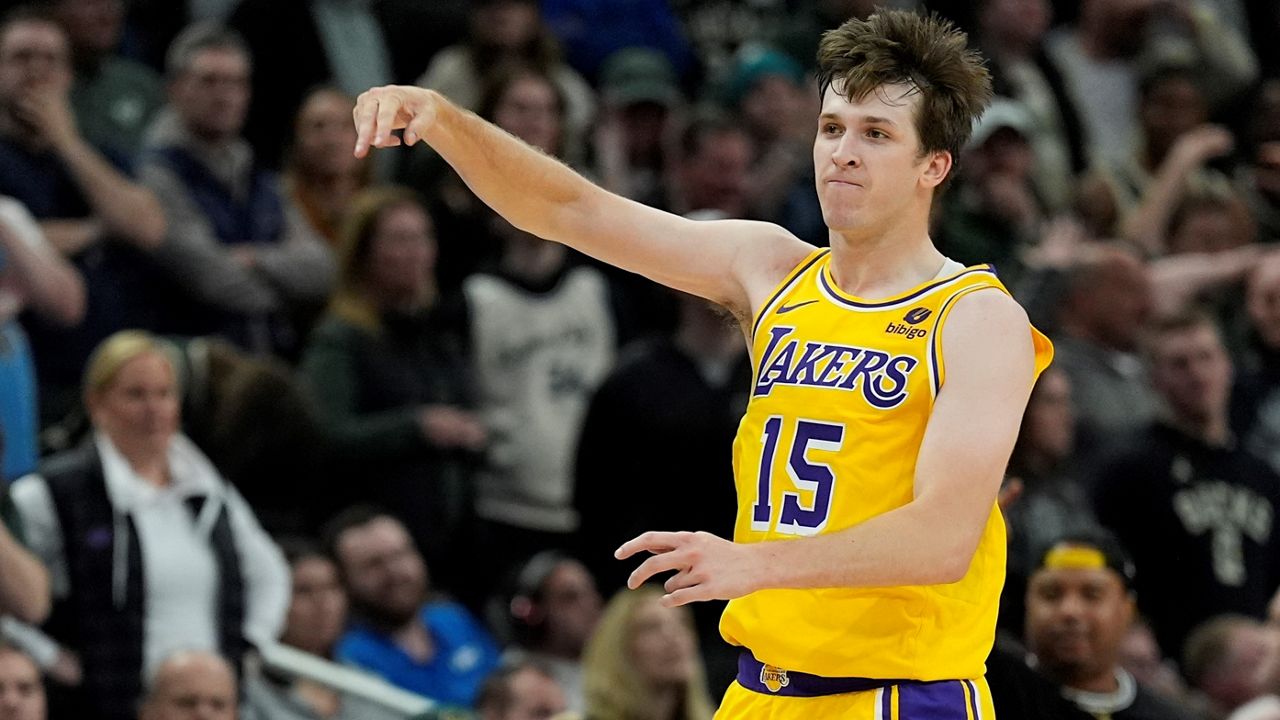 Los Angeles Lakers' Austin Reaves reacts after making a three pointer during the second overtime of an NBA basketball game against the Milwaukee Bucks Tuesday, March 26, 2024, in Milwaukee. (AP Photo/Morry Gash)
