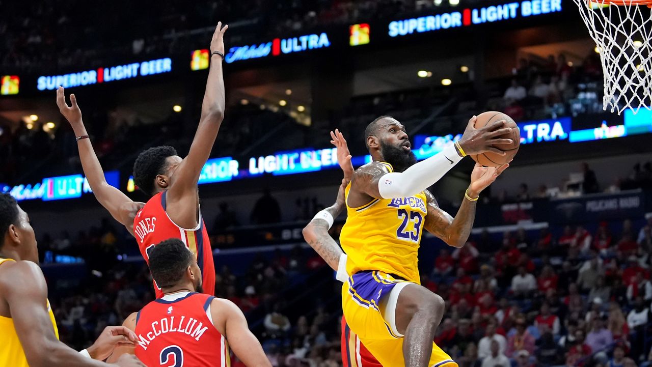 Los Angeles Lakers forward LeBron James (23) goes to the basket in the first half of an NBA basketball play-in tournament game against the New Orleans Pelicans, Tuesday, April 16, 2024, in New Orleans. (AP Photo/Gerald Herbert)