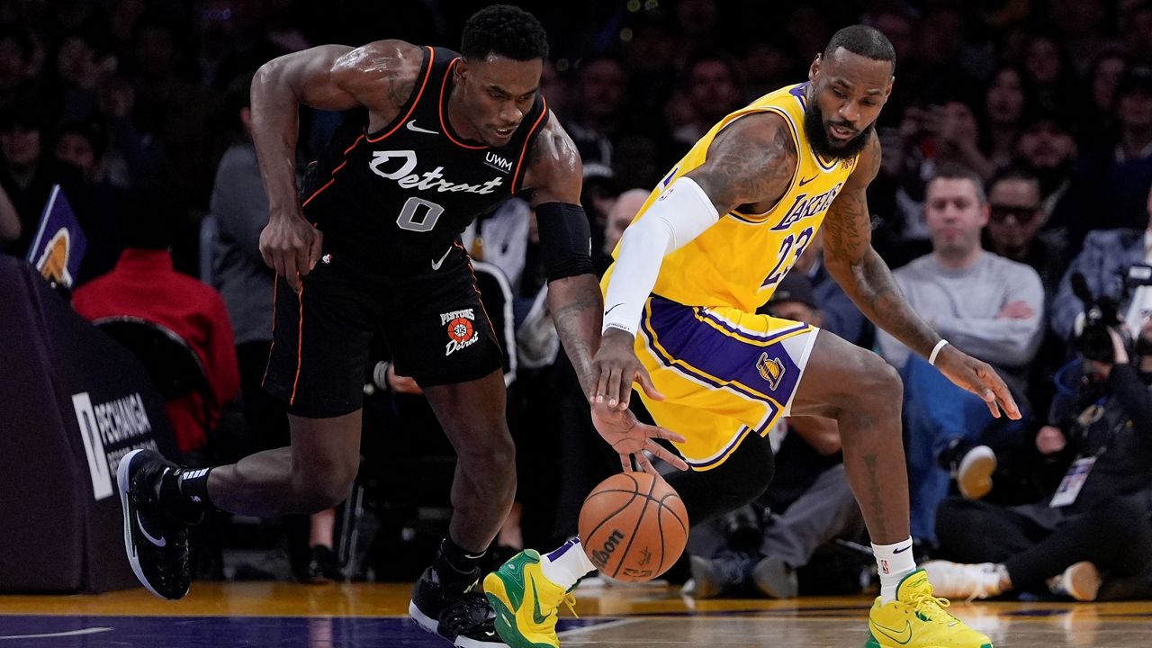 Detroit Pistons center Jalen Duren, left, steals the ball from Los Angeles Lakers forward LeBron James during the first half of an NBA basketball game, Tuesday, Feb. 13, 2024, in Los Angeles. (AP Photo/Ryan Sun)