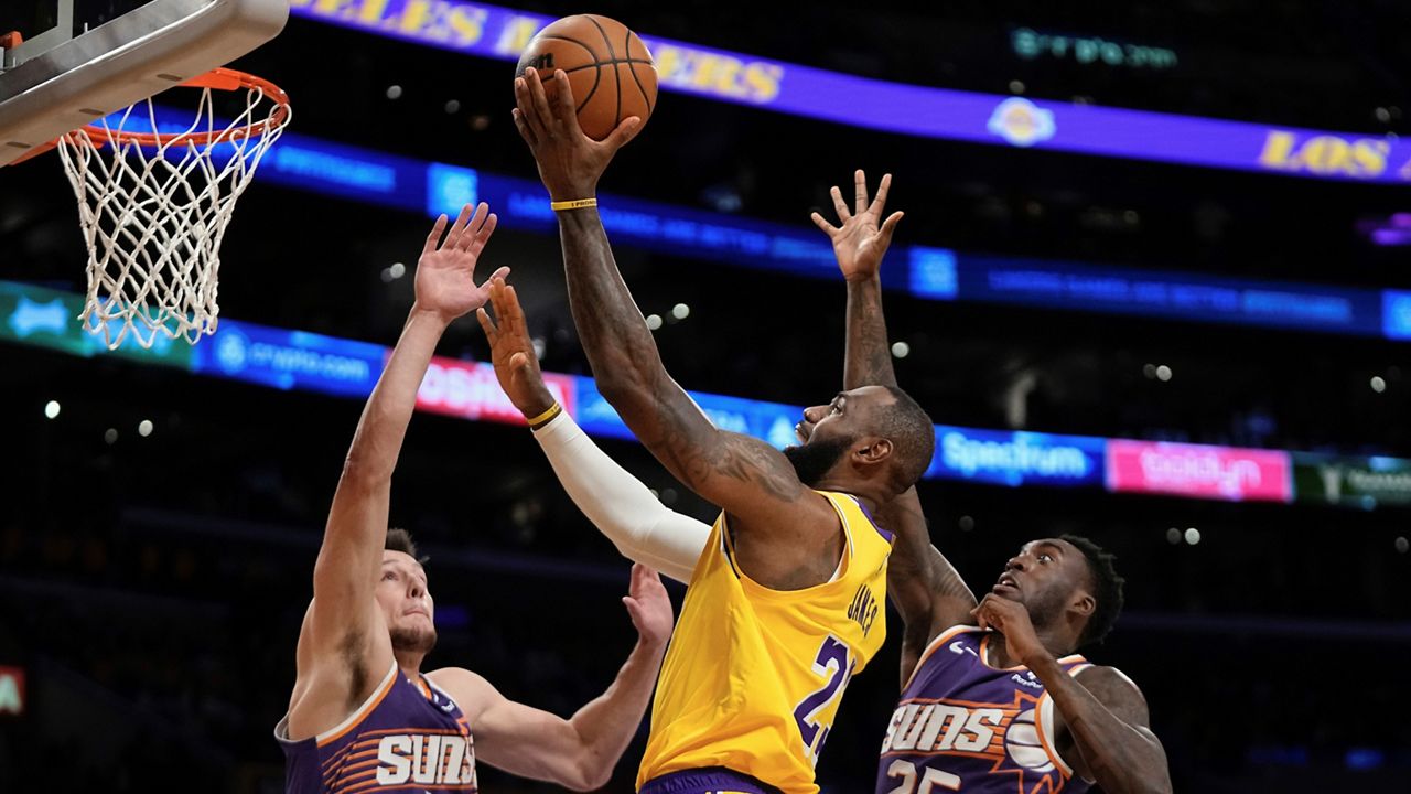 LeBron James turns up to Lakers' opener against the Nuggets in