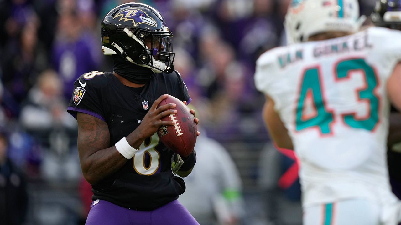 Baltimore Ravens quarterback Lamar Jackson (8) looks to pass under pressure from Miami Dolphins linebacker Andrew Van Ginkel (43) during the second half of an NFL football game in Baltimore, Sunday, Dec. 31, 2023. (AP Photo/Matt Rourke)