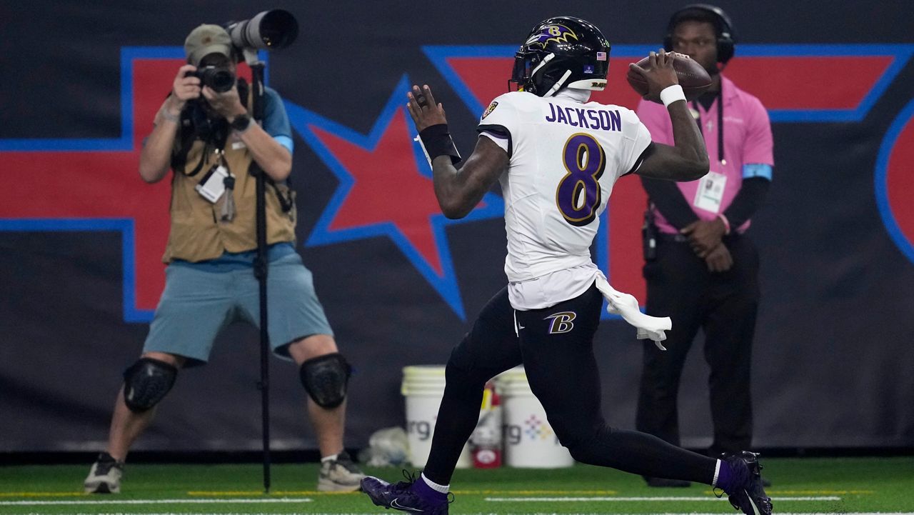 Baltimore Ravens quarterback Lamar Jackson (8) celebrates after a 48-yard touchdown run during the second half of an NFL football game against the Houston Texans, Wednesday, Dec. 25, 2024, in Houston. (AP Photo/David J. Phillip)