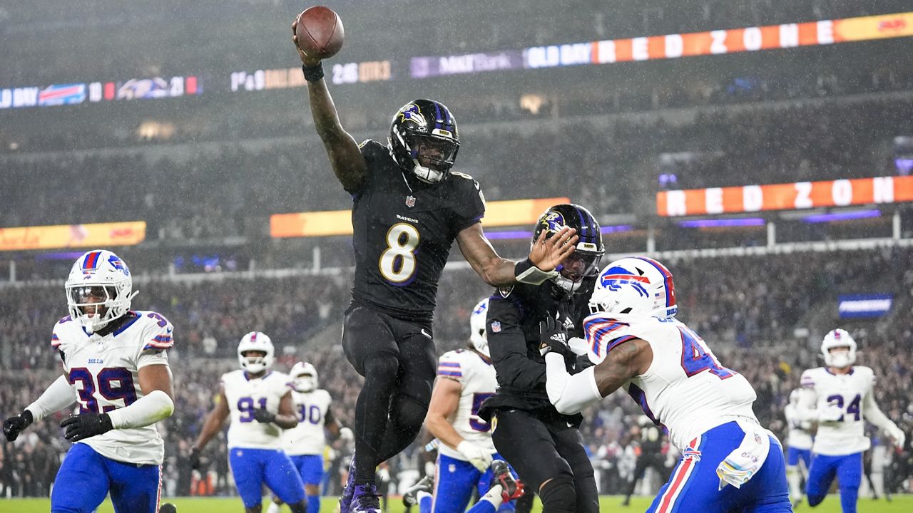 Baltimore Ravens quarterback Lamar Jackson (8) scores a touchdown against the Buffalo Bills during the second half of an NFL football game, Sunday, Sept. 29, 2024, in Baltimore. (AP Photo/Stephanie Scarbrough)